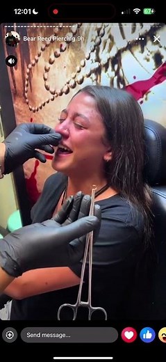 Girl screams while getting nose piercing