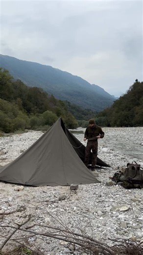 Bushcraftsman Raf on Instagram: "We followed the sound of running water and found this quiet mountain river 🌲a peaceful spot that felt just right for setting up camp 🏕️. I’ve been wanting to try this cotton Lavvu Tarp from @wildoor.de for a while now, and this was the perfect moment to pitch it. As many of you know, we really appreciate natural materials in the outdoors 🌿 and these handmade tarps from @wildoor.de are something special. The setup is simple, and the covered