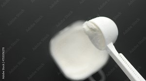 baby milk powder pouring from spoon