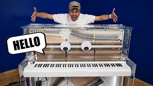 A Googly-Eyed Transparent Player Piano That Speaks English and Can Play 'Rush E'