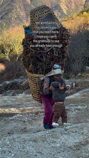She carries the world on her back and still smiles