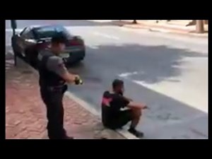 Video shows officer using stun gun on man sitting on sidewalk