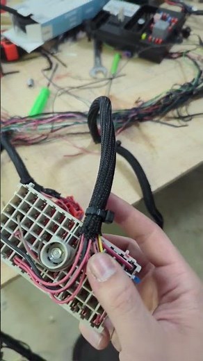 putting loom on automotive wiring harness