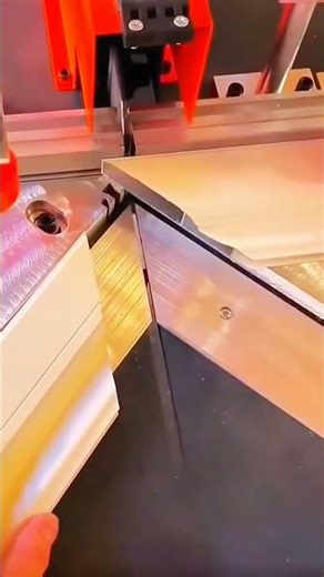 Blade cuts angle—hand holds rhythm of guide, extrusion, and frame bonds true with crafted precision