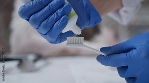 This video shows a professional demonstrating proper dental hygiene. It highlights the right amount of toothpaste on a toothbrush and emphasizes oral health