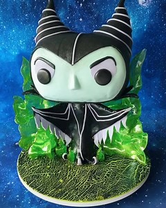 1.8M views · 817 reactions | ✨NEW TUTORIAL✨ Maleficent Funko POP cake with isomalt flames  www.sugargeekshow.com | Sugar Geek Show | Facebook