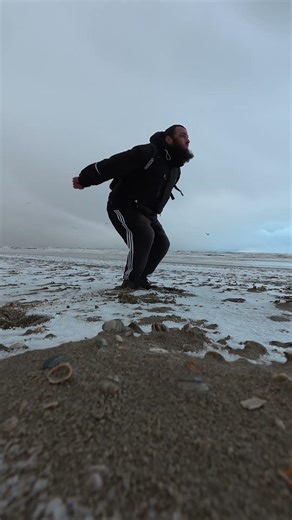 Three vertical jumps and a tuck jump, with a backpack on (in the winter, on the beach)