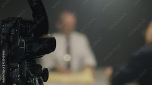 Police interrogation scene with detective and suspect