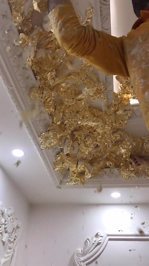 Applying Artificial Gold Leaves to Ceiling Decoration