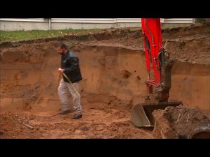 Segmental Retaining Wall Construction - Bench Cut Excavation