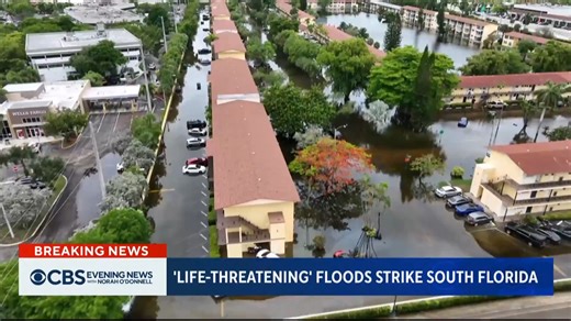 Five counties are under a state of emergency following record-breaking rainfall that is battering South Florida, leaving cars submerged and entire neighborhoods under water. | CBS Evening News