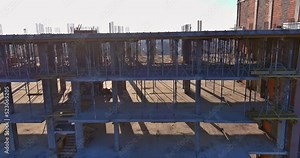 A multi-storied apartment building is being constructed along the way, is still in progress on building works on construction site