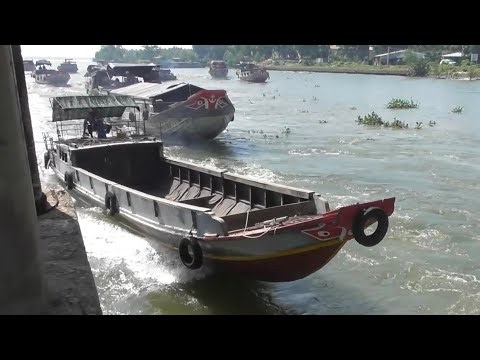 Impressive and eye-catching boats crossing the sluice gate