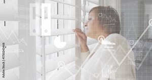 woman parting shutter slat and peering out while generating animated data overlays tracking metrics