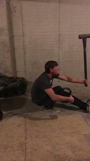 one legged squat while levering 12 lbs sledgehammer