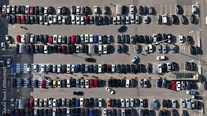 Shopping centre parking lot with Cars searching for parking spots, Aerial view. Dynamic shot over crowded parking lot. Stock Video