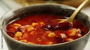 Hearty Soup with Kidney Beans and Rice in a Cozy Rustic Setting, creating a comforting meal