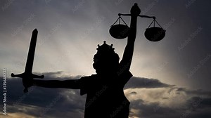 Symbol of Judicial System: Time Lapse with Image of Lady Justice in Silhouette at Sunrise