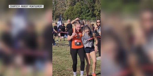 ‘I can’t leave her, I have to help her:’ Student helps runner cross finish line