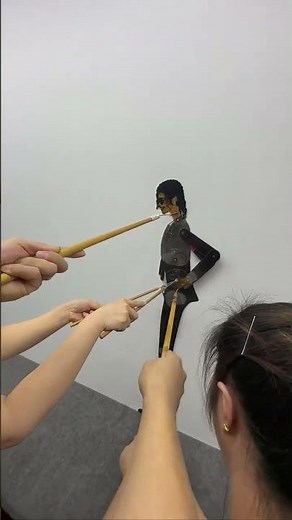 Shadow puppetry performs Michael Jackson's classic dance moves.