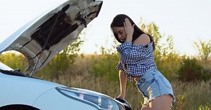 Pretty Middle Aged Woman Having Car Troubles  Broken Down Car on the Side of the Road