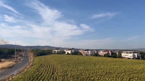 Haze covers homes as wildfire spreads in western Turkey