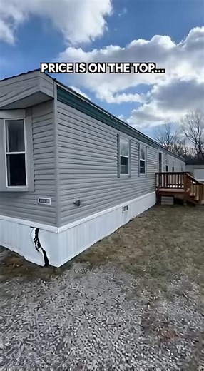 used mobile home priced at $15,800 The exterior shows straight metal siding and level placement, with only one cracked skirting corner needing repair. Inside, the home offers a bright living room, a kitchen with older but clean cabinets, a spacious bedroom with good light, and a functional bathroom. | Mobile Homes For Sale Under 5000