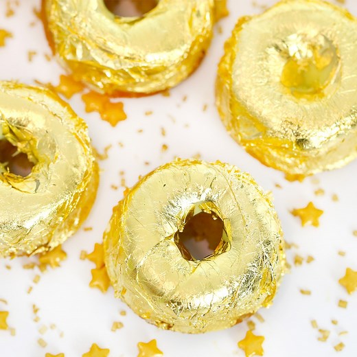 You've literally struck gold with these mini doughnuts coated in glamorous edible gold leaf. | Tastemade