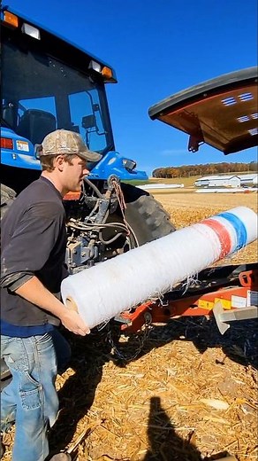 Loading the round baler with net wrap! #agriculture #newholland #farm #bale #farming #farmer