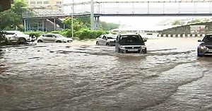 People Wade Through Submerged Roads After Heavy Rain In Gurgaon