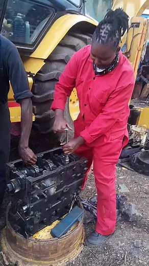 Female Plant Operator Shows Heavy Machinery Skills