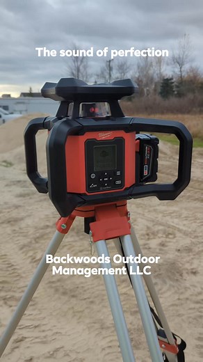 Using the new Milwaukee M18 dual slope rotary laser to level a barn pad in Riley Township today. | Backwoods Outdoor Management LLC