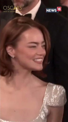 Actor Emma Stone Posing For Photographs On Oscars Red Carpet | N18S