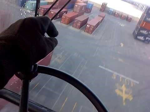 Operating a Straddle carrier at work.