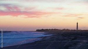 Cape May NJ lighthouse and Atlantic Ocean at sunset in springtime