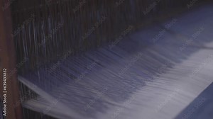 The threads on traditional looms move up and down to form cloth