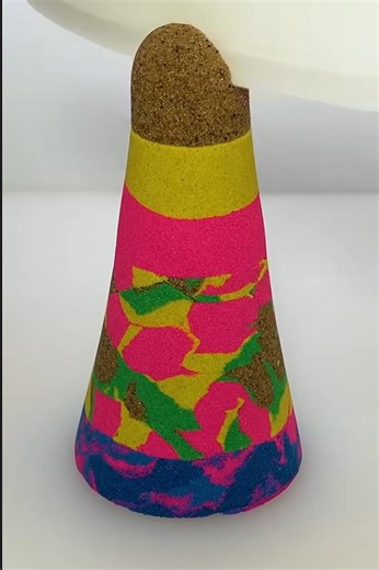 Patterned multicolor sand sculpture cone