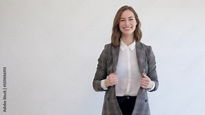 Video of a professional business woman smiling and looking cute with big smile in camera. Showing confidence, joy and success.