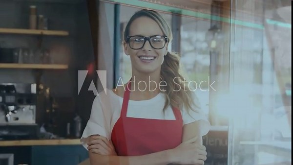Cafe owner in apron smiling behind counter rising sun causing code overlays over torso for promo