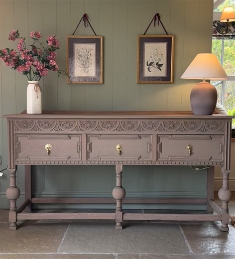 *Available. A beautiful rustic console table that has been finished in a lovely natural warm weathered oak style. It has a beautiful design with pretty carvings. It would look beautiful in a period home or a home looking to add some rustic character and charm. There are pretty carvings and three large drawers with dovetail joints with pretty solid aged brass handles. It is a vintage piece that has been meticulously sodablasted back to raw wood and has been refinished. A lovely addition to hallwa