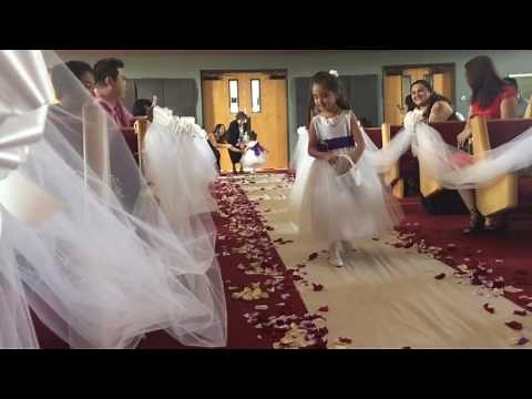 2 yr old flower girl Franzelle walking down the aisle
