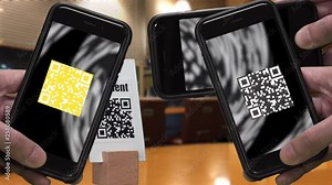 Scanning QR CODE look alike black and white pattern (CAN NOT SCAN THIS) to make a cashless payment via smartphone at the store. Colorful QR CODE flashing on smartphone screen.