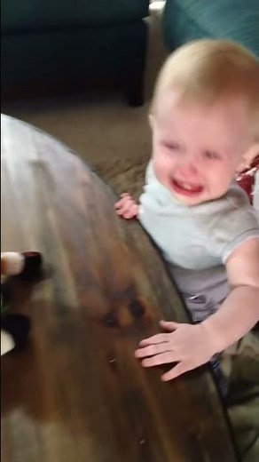 Baby scared of giraffe toy - funny