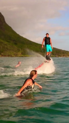 Flying over the water on a powered board