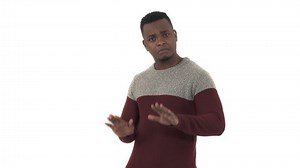 Young man making calm down gesture. Body language concept. Isolated, on white background