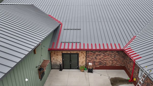 Commercial metal roof ice dam prevention with heat tape