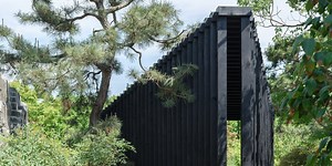 vertical louvered wooden columns form temp's 3-to-1 triangular pavilion in shanghai