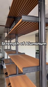 Shelving you'll never have to replace. Sleek, strong, and fully customizable.🔥 This series uses wood grain aluminum shelves so you get that unique look of wood with the strength and eco-friendliness of aluminum. It's also modular, so you can start small, expand, reconfigure, take it with you, and pass it down. Shop online or get a free design! 🎥 by @brandon_bucket | Modern Shelving