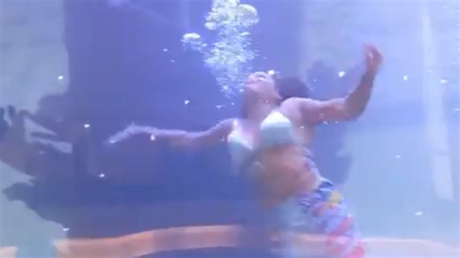 Moment ‘mermaid’ nearly drowns after tail gets stuck in front of crowd
