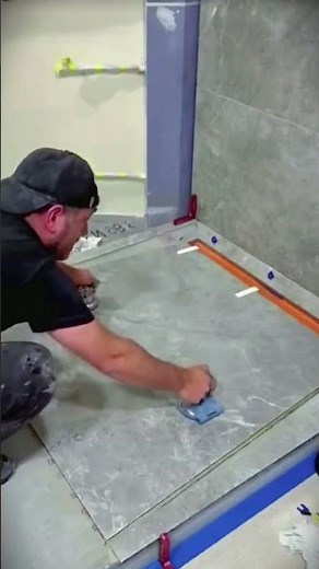 The process of the craftsman installing the ceramics is expert and precise #shorts